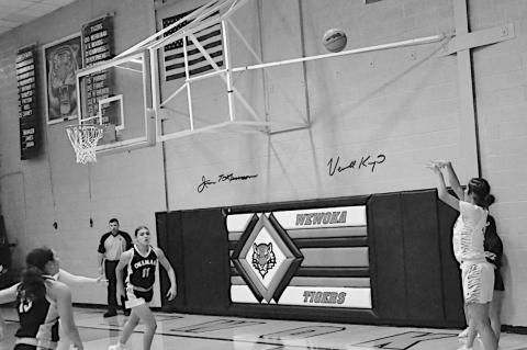 Wewoka Lady Tiger Emma Slovacek takes a shot from three-point range Friday night at home against Okemah. Staff Photo by Bill Anderson