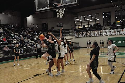 Seminole Lady Chieftain Kassidy Baker fights for the basket Thursday night. Staff Photo by Bill Anderson
