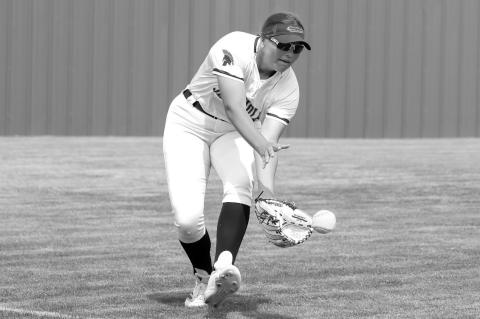 Seminole State Lady Trojan Kenna Maker fielding the ball in the left field. Courtesy Photo by Glen Bryan