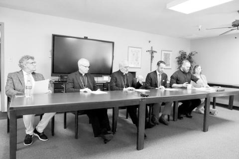 The Board of Directors for St. Isidore of Seville Catholic Virtual School, along with Tulsa Bishop David Konderla, second left, and Oklahoma City Archbishop Paul Coakley, third left, meet June 28, 2024, at the Diocese of Tulsa’s Chancery Office in Broke