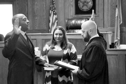Seminole County Sheriff Anthony Louie (left) was administered the Oath of Office for his first full term by District Judge Brett Butner Thursday, Jan. 2 at the Seminole Municipal Courthouse. Louie’s wife, Lureena, held the Bible during the ceremony. Lou