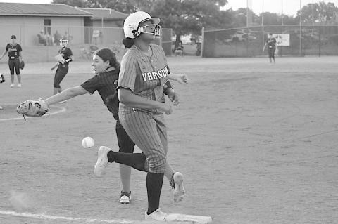 Varnum Lady Whippet Faith Madkins just beats the throw at first as the ball just passes Konawa Lady Tiger Bliss Henson’s glove Friday night. Konawa won 1-0. Staff Photo by Bill Anderson