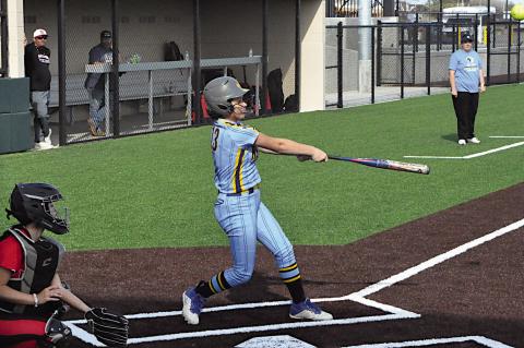 New Lima Falconette Jaidyn Hinton gets a hold of the ball Monday afternoon. Staff Photo by Bill Anderson