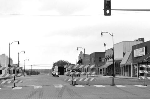 Main Street was closed from Broadway to Seminole Street Monday morning as crews began to prepare to pave over the bricks in the street. A self-leveling asphalt will be put down first followed by a thicker layer. The closure is expected to last through May
