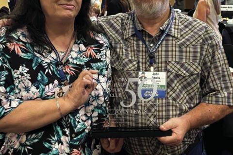 Left: John Lewis with the bicycle and paper bag that he used to deliver the Seminole Producer. Pictured above is John and his wife, Laurie, at the Oklahoma Press Association awards luncheon held June 7 at the Grand Casino. Laurie is also a longtime Produc