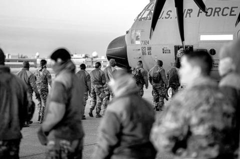 Oklahoma National Guard Soldiers board a C-130 at Will Rogers Air National Guard Base in Oklahoma City, Jan 16, 2025. The Guardsmen join nearly 8,000 National Guard Soldiers and Airmen from approximately 40 states and territories to augment the District o