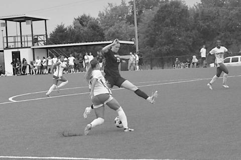 Seminole State Lady Trojan Leslie Razo changes direction on the Rose State defender. Staff Photo by Bill Anderson