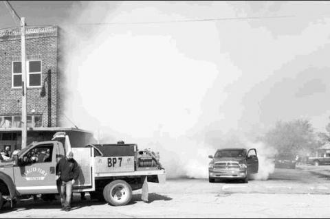Spectators Line Maud Main Street for Drag Race Event