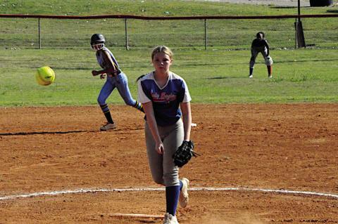 Butner Lady Eagle Jaycee Johnson throw the fast ball to the New Lima batter Thursday. Staff Photo by Bill Anderson