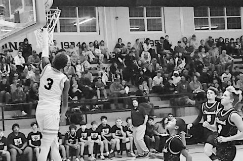 Wewoka Tiger Bill Stephens drives in for the layup Friday night against Okemah. Staff Photo by Bill Anderson
