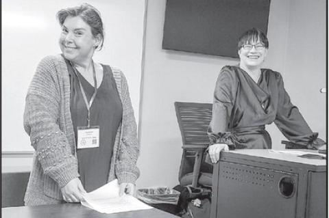 Kara Stanley (right), SSC Adjunct Professor of Biology, delivered a presentation during the event, with assistance from Associate Professor of English Yasminda Choate.