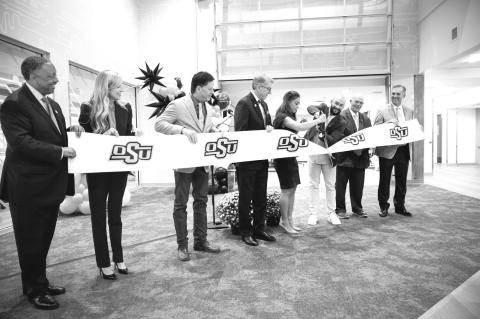 OSU President Jim Hess and university leaders cut the ribbon on a newly renovated hall Thursday at OSUTulsa as part of the Orange Impact event. (OSU photo)