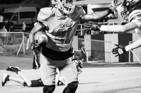 Seminole Chieftain RB Timothy McFadden goes for a stiff arm. Courtesy Photo by Ben Schatzel