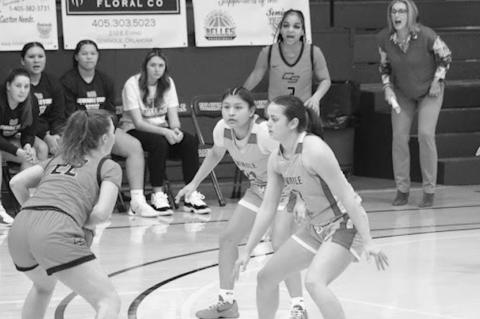 Connor State’s player runs into a Seminole State defensive wall Saturday consisting of Tylyn Thurman and Alona Cooper-Rochovitz. Courtesy Photo by Jeanne Gosa