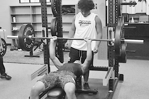 Wewoka Tiger athletes workout and do some conditioning in their fairly new gym Tuesday morning during their Summer Pride. Staff Photo by Bill Anderson