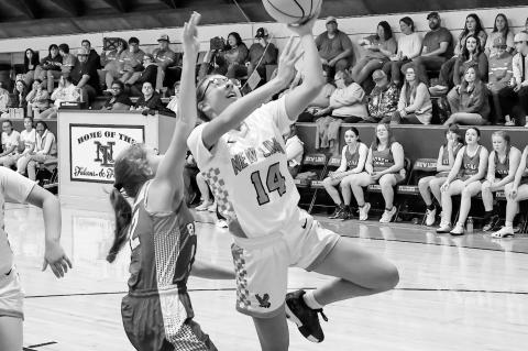 New Lima Falconette Jazzy Harjo gets past Butner’s defender Bella Jones for the layup Friday night. Courtesy Photo by Glen Bryan