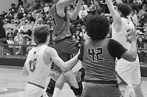 Varnum Whippet C.J. Bernard goes up for the shot Friday night. Staff Photo by Bill Anderson