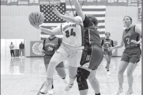 Courtesy Photo by Glen Bryan Seminole Lady Chieftain Aundrea Tagg drives down the lane to put up a shot.