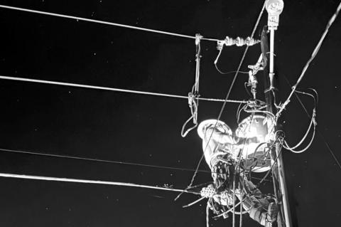 Above, Canadian Valley lineman Kaden Thomas works to restore power after the recent tornado in Harrah, Oklahoma. A new report shows CVEC leads the state in power reliability. (CVEC photo)