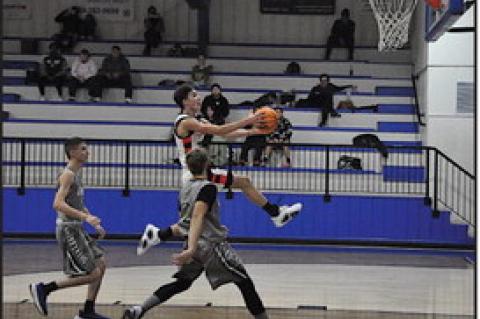 Konawa Tiger Tanner Johnson flies in MJ style for the basket Thursday. Staff Photo by Bill Anderson