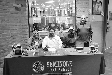 Johnson Signs to OBU Staff Photo by Bill Anderson Seminole Chieftain Martez Johnson signs Letter of Intent to Oklahoma Baptist University to play football. Pictured is Johnson and family with Head Coach Mike Synder.