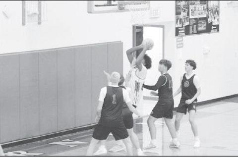 Courtesy Photo by Jeanne Gosa Varnum Whippet Jon Madkins gets the rebound and makes the basket against Verden Friday.