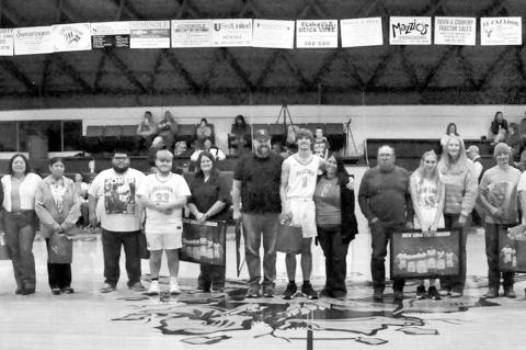 Seniors at New Lima High School were honored Thursday night at school’s home basketball game against Olive. Most schools have a tradition of honoring seniors during an athletic event, Those honored, along with their family members, were (l-r) Beau Sneed