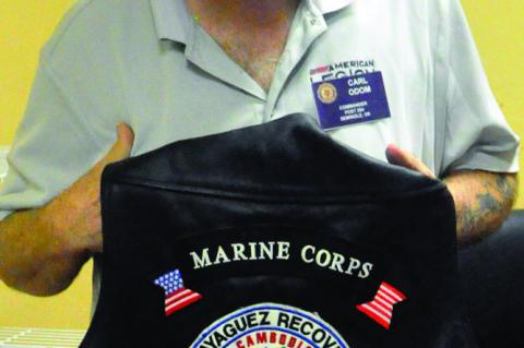 Carl Odom displays his highly decorated leather vest, which includes a special patch commemorating the Mayaguez Incident at Koh Tang. May 12 is the 50th anniversary of the battle. (Staff photo by Bill Anderson)