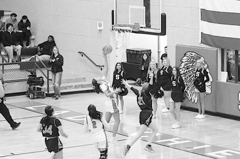 Varnum Lady Whippet Jazmyn Williams goes up for the shot as Strother Lady Yellowjacket Ava Kornelsen tries to block the shot. Varnum won 49-40. Courtesy Photo by Jeanne Gosa