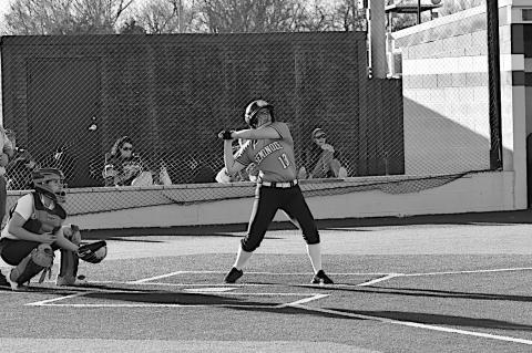 Seminole Lady Chieftain Layla Griffin eyes the ball and knocks it into the outfield Friday. Staff Photo by Andy Wilson