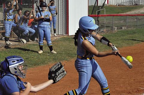 New Lima Falconette Jaylee Ipock gets a hold of one Thursday afternoon. Staff Photo by Bill Anderson