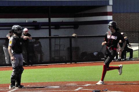 Sasakwa Viking Kaisyn Shaw scores a run against Boswell Friday. Staff Photo by Bill Anderson