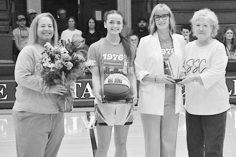 Seminole State College women’s basketball Head Coach Rita Story-Schell was honored during the Belles’ home game Monday, Feb. 16, after earning her 450th career win with a Feb. 12 victory over Western Oklahoma State College in Altus. Pictured (left to 