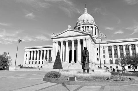 The Oklahoma Capitol, with a Christmas tree in front, is shown in this Wednesday, Dec. 4, 2024, photo. (Paul Monies/Oklahoma Watch)