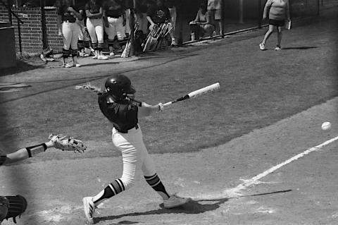 Seminole State Lady Trojan McKenzie Cothran hits a line drive to get on base. Staff Photo by Bill Anderson