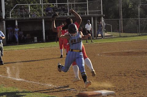 New Lima Falconette Layla Cecil beats the ball at first base Thursday. Staff Photo by Bill Anderson