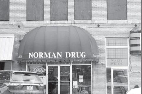 Pictured right is Norman Drug in downtown Wewoka. The store’s 100th anniversary celebration is scheduled for this Saturday. (Staff photo by Andy Wilson)