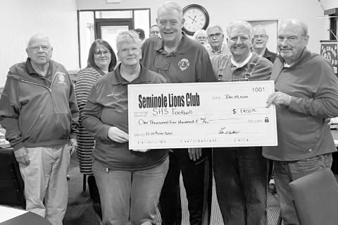 Right, the Seminole Lions Club this week presented Seminole High School Football Head Coach Mike Snyder with a $1,400 check from the sale of rosters at home games during the 202324 season. Pictured presenting the check are Sequeeta Potter, Neil Craig and 