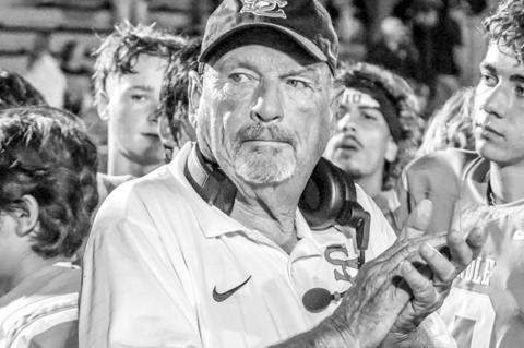 Seminole Chieftains Head Coach Mike Snyder claps along to the fight song after the team’s Homecoming victory over Lone Grove on Sept. 26. Snyder has been suspended for tonight’s game against Perkins-Tryon. Coach Steven Huff will handle the coaching du
