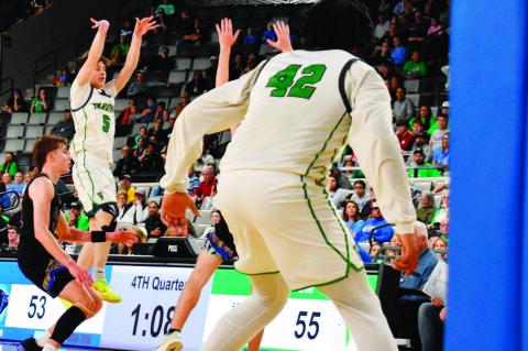 Varnum’s Daison Hadley fires off a three-point attempt against Glencoe in quarterfinals action Thursday. Varnum moved on to semifinals and were slated to play Calumet Friday afternoon. Due to print deadlines, the outcome will be in our next edition. —