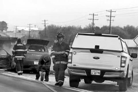 Left and below: Firefighters rushed to extinguish a vehicle fire early Wednesday morning in the southbound lanes of Highway 9. A Ford Bronco caught fire and suffered extensive damage. Fire officials say the reason for the blaze was unknown. Traffic was sn