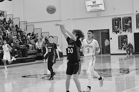 Seminole Chieftain Braydon Kolander takes the shot from beyond the arch Saturday night. Staff Photo by Bill Anderson