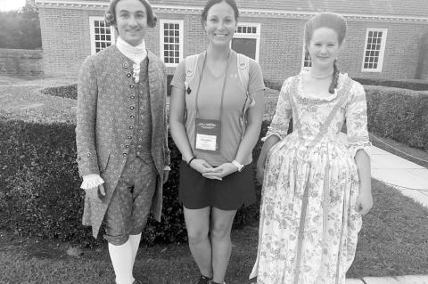 Washington Middle School educator Jennifer Gay, center, visits with character interpreters during her visit to the Bob and Marion Wilson Teacher Institute of Colonial Williamsburg in June 2025. (Photo provided).