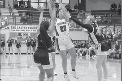 Seminole Lady Chieftain Dyliah Hymes shoots over the Okemah defenders Friday night. Courtesy Photo by Glen Bryan