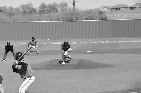 Seminole State Trojan pitcher Declan Dahl throws the fast ball to the awaiting Connors State batter. Staff Photo by Bill Anderson