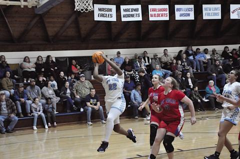 New Lima Falconette Aubrey Washington flies in for the layup Thursday night against Life Christian. Staff Photo by Bill Anderson