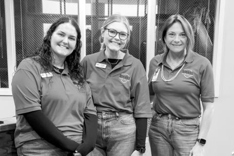 Left, SSC GEAR UP Educational Coordinators (from left) Leah Martin, Zoe Blue and Kate Sprague greet attendees at the Oklahoma’s Promise Family Event on March 7. Above, Strother Middle School students Aubree Fleming (left) and Cara Fleming (right) play a