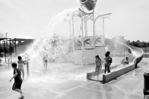Splish, Splash! —Staff Photo by Bill Anderson Area youngsters frolic in the cool waters of the Seminole Splashpad Tuesday morning, June 10. The waterpark officially opened for business on Memorial Day weekend and is open from 8 a.m. until 8 p.m., seven 