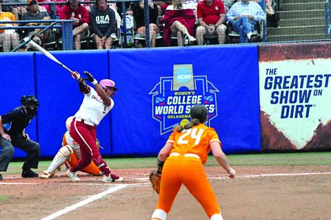 OU Ella Parker just misses the throw before hitting her first homerun of the game Thursday. Staff Photo by Bill Anderson