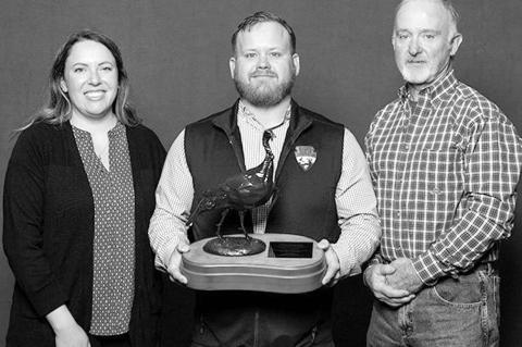 Marcus Thibodeau, Oklahoma Department of Wildlife Conservation senior biologist (center), was presented with the Joe Kurz Wildlife Manager of the Year Award by the National Wild Turkey Federation. (Photo provided)